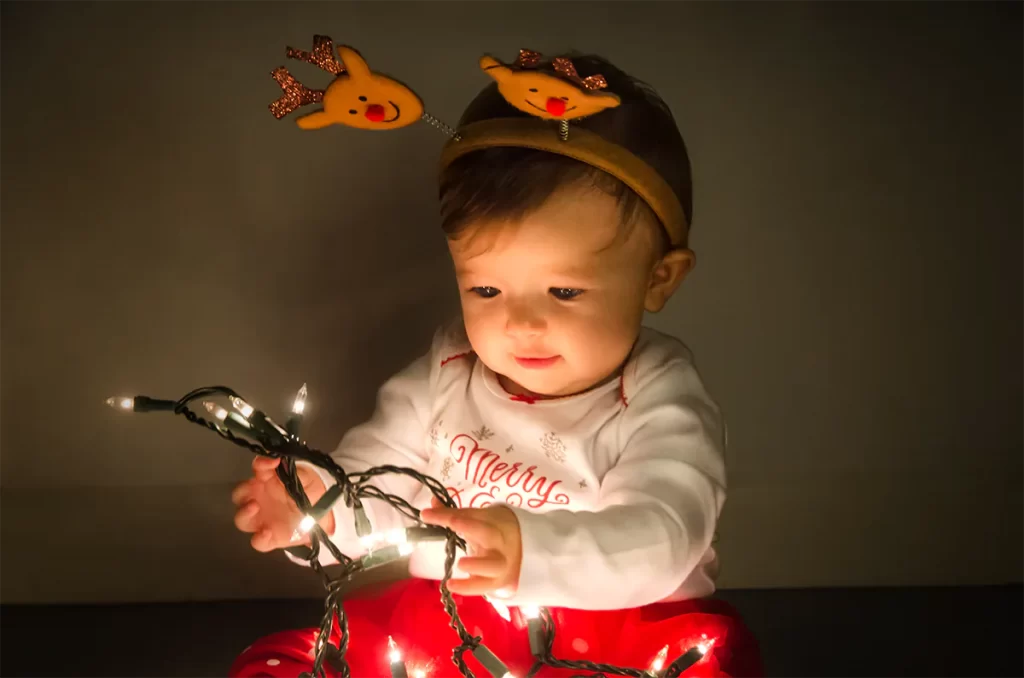 Toddler with Christmas Lights Portrait